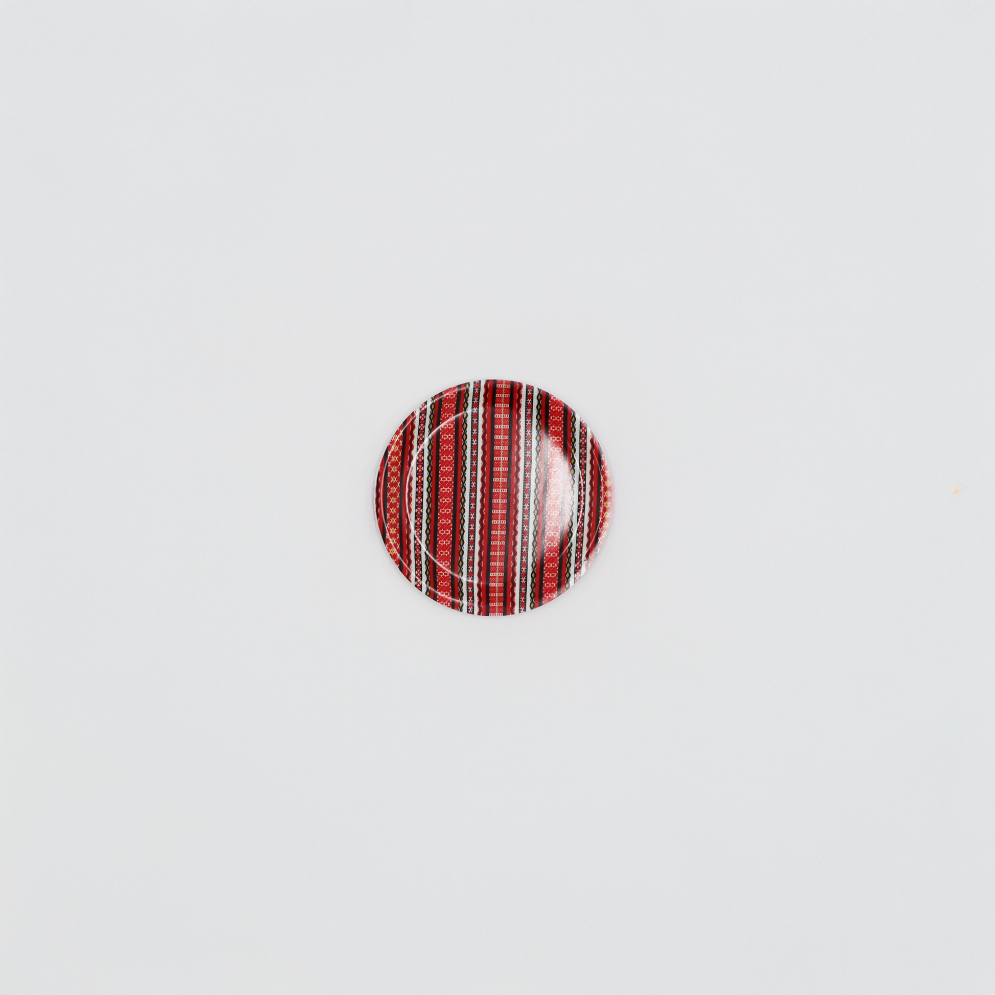 Glasunderlägg Tina dekorativ dalainspirerad design.